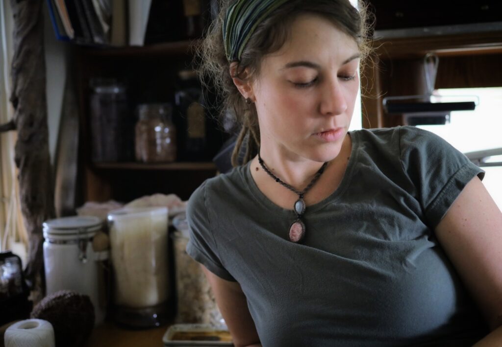 Portrait of artist Sarah A Uys in a reclaimed-materials studio
